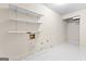 A storage area includes shelves and white tile flooring at 180 Habersham Pl, Fayetteville, GA 30214