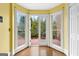 Bright sun room features wood floors and an exterior door leading to a patio at 180 Habersham Pl, Fayetteville, GA 30214