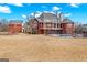Large backyard featuring a pool, a full fence, and multiple access points to the house at 560 Birkdale Dr, Fayetteville, GA 30215