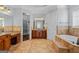 An elegant Primary bathroom features double vanities, a soaking tub, and a walk-in closet at 560 Birkdale Dr, Fayetteville, GA 30215