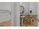 Unique half bath adjacent to laundry room featuring tile and decorative elements at 560 Birkdale Dr, Fayetteville, GA 30215