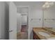 Bathroom featuring tile floors, granite counters, and a large mirror at 560 Birkdale Dr, Fayetteville, GA 30215