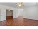 Spacious bedroom with hardwood floors, white trim and paint, and a ceiling fan at 560 Birkdale Dr, Fayetteville, GA 30215