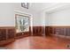 Spacious bedroom featuring hardwood floors, wood paneling and natural light at 560 Birkdale Dr, Fayetteville, GA 30215