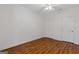 Bedroom featuring hardwood floors, a closet, a ceiling fan and white trim at 560 Birkdale Dr, Fayetteville, GA 30215