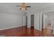 Bedroom with a ceiling fan, wood floors, and access to closet and bathroom at 560 Birkdale Dr, Fayetteville, GA 30215