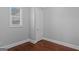 Bedroom featuring neutral walls, hardwood floors, and natural light from a window at 560 Birkdale Dr, Fayetteville, GA 30215