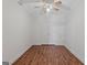 This bright bedroom features wood floors, ceiling fan and spacious closet, perfect for storage at 560 Birkdale Dr, Fayetteville, GA 30215