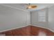 Bedroom featuring wood floors, a ceiling fan, and natural light at 560 Birkdale Dr, Fayetteville, GA 30215