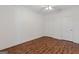 Large bedroom featuring wood floors, ceiling fan and double door closet, perfect for rest and relaxation at 560 Birkdale Dr, Fayetteville, GA 30215