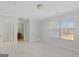 Spacious bedroom with neutral walls and carpet, showing a bathroom en suite at 560 Birkdale Dr, Fayetteville, GA 30215
