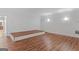 Large bonus room with wood floors features recessed lights and neutral walls, perfect for entertaining at 560 Birkdale Dr, Fayetteville, GA 30215