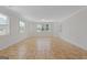 Large bonus room with tile flooring, white trim, and three large windows at 560 Birkdale Dr, Fayetteville, GA 30215