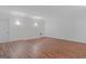 Spacious bonus room with wood floors, recessed lights and neutral walls is perfect for entertaining at 560 Birkdale Dr, Fayetteville, GA 30215