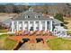 Rear view of clubhouse, showcasing outdoor dining and lush green surroundings at 560 Birkdale Dr, Fayetteville, GA 30215