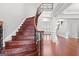 Grand foyer with wood staircase, iron railing and hardwood flooring at 560 Birkdale Dr, Fayetteville, GA 30215