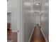 Hallway with wood floors and recessed lighting leading to the bathroom at 560 Birkdale Dr, Fayetteville, GA 30215