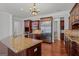 Bright kitchen featuring a large island with granite countertops and stainless steel appliances at 560 Birkdale Dr, Fayetteville, GA 30215