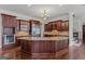 Gourmet kitchen featuring a large island with granite countertops and stainless steel appliances at 560 Birkdale Dr, Fayetteville, GA 30215