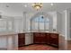 Kitchen island offering a seamless transition to the living area with fireplace and natural light at 560 Birkdale Dr, Fayetteville, GA 30215