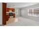 Bright kitchen area featuring wood cabinets, stone countertops, and stainless steel appliances at 560 Birkdale Dr, Fayetteville, GA 30215