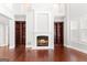 Bright living room with hardwood floors, built-in bookshelves and fireplace at 560 Birkdale Dr, Fayetteville, GA 30215