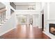 Spacious open concept living room with fireplace, staircase and natural light at 560 Birkdale Dr, Fayetteville, GA 30215