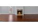 A stone fireplace adds warmth and charm to the hardwood-floored living room at 560 Birkdale Dr, Fayetteville, GA 30215