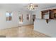 Bright living room with tile floors, ceiling fan, and bar area is great for entertaining guests at 560 Birkdale Dr, Fayetteville, GA 30215