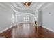 Spacious living room boasts hardwood floors, recessed lighting, a ceiling fan, and an inviting fireplace at 560 Birkdale Dr, Fayetteville, GA 30215