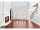 Bright living room featuring large fireplace, hardwood floors, and second story windows at 560 Birkdale Dr, Fayetteville, GA 30215
