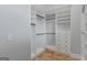 The walk-in closet features custom shelves and drawers for optimal organization at 560 Birkdale Dr, Fayetteville, GA 30215