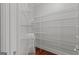 A well organized, all-white walk-in closet providing ample storage at 560 Birkdale Dr, Fayetteville, GA 30215