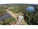 Aerial view showcasing the property's setting near two ponds and surrounded by lush greenery at 545 Discovery Lake Dr # 409, Fayetteville, GA 30215