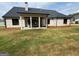 Spacious backyard with a covered patio, perfect for outdoor entertaining and relaxation at 545 Discovery Lake Dr # 409, Fayetteville, GA 30215