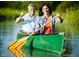 A smiling couple enjoying canoeing on the water, showcasing the community's active lifestyle at 545 Discovery Lake Dr # 409, Fayetteville, GA 30215