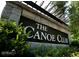 Close-up of The Canoe Club sign, highlighting the community's name and stone details at 545 Discovery Lake Dr # 409, Fayetteville, GA 30215