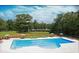 Stunning community pool with ample seating and lush landscaping, perfect for relaxing and socializing at 545 Discovery Lake Dr # 409, Fayetteville, GA 30215