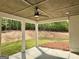 Inviting covered patio with ceiling fan, offering a serene outdoor space to relax and enjoy nature at 545 Discovery Lake Dr # 409, Fayetteville, GA 30215