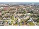 Aerial view pinpointing home in a residential neighborhood surrounded by lush greenery and urban conveniences at 906 Sims Sw St, Atlanta, GA 30310