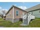 Back of house featuring a deck with access stairs and a patio perfect for entertaining and relaxation at 906 Sims Sw St, Atlanta, GA 30310