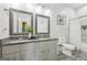 Bathroom with dual vanity, gray countertops, and a shower-tub combination at 906 Sims Sw St, Atlanta, GA 30310