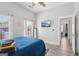 Modern bedroom features a flat-screen TV, lots of natural light, and beautiful wood flooring, offering both style and comfort at 906 Sims Sw St, Atlanta, GA 30310