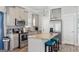 Modern kitchen with stainless steel appliances, an island, and gray cabinets at 906 Sims Sw St, Atlanta, GA 30310