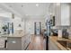 Bright and modern kitchen featuring a large island, stainless steel appliances, and open layout at 906 Sims Sw St, Atlanta, GA 30310