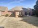 Backyard featuring a screened-in porch and a well-maintained lawn at 1832 Glenwood Ln, Snellville, GA 30078