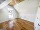 Cozy bedroom with hardwood floors and a bright window, offering a comfortable space at 1832 Glenwood Ln, Snellville, GA 30078