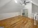 Spacious bonus room with wood floors, fan, and open door to a walk-in closet at 1832 Glenwood Ln, Snellville, GA 30078