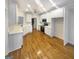 Spacious kitchen featuring white cabinets, hardwood floors and stainless steel appliances at 1832 Glenwood Ln, Snellville, GA 30078