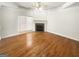 Bright living room featuring a fireplace and beautiful hardwood floors at 1832 Glenwood Ln, Snellville, GA 30078